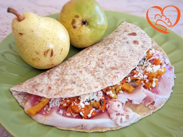 Piadina integrale con peperonata e porchetta