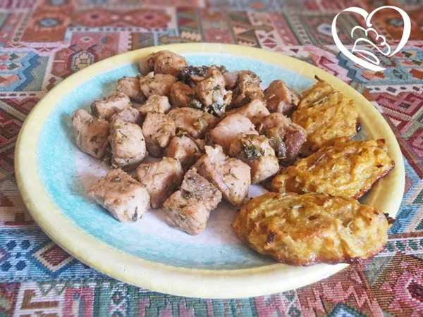 Spezzatino di maiale con spicchi di rosti al rosmarino